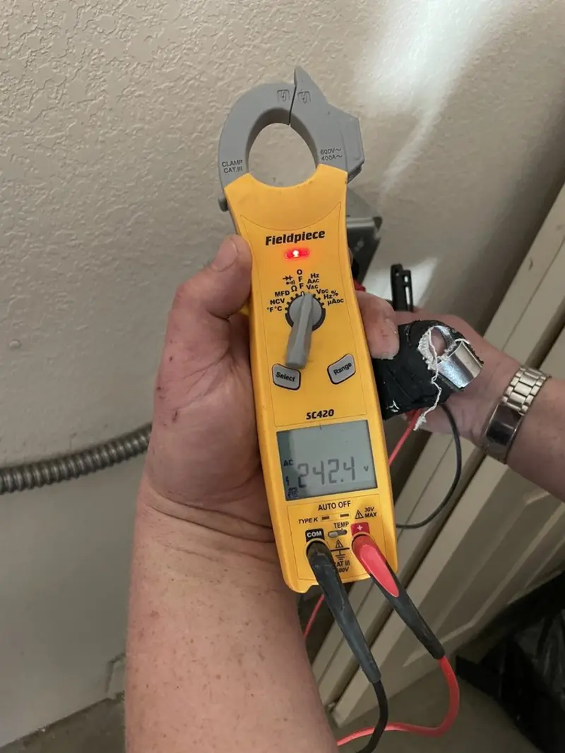 Voltage testing with clamp meter during Whole House Surge Protector in Wellington